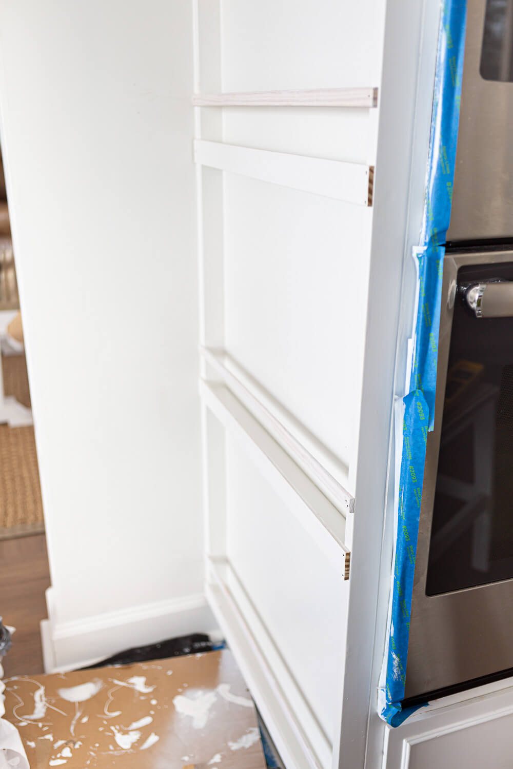 Building a plate rack on a narrow wall in a kitchen.