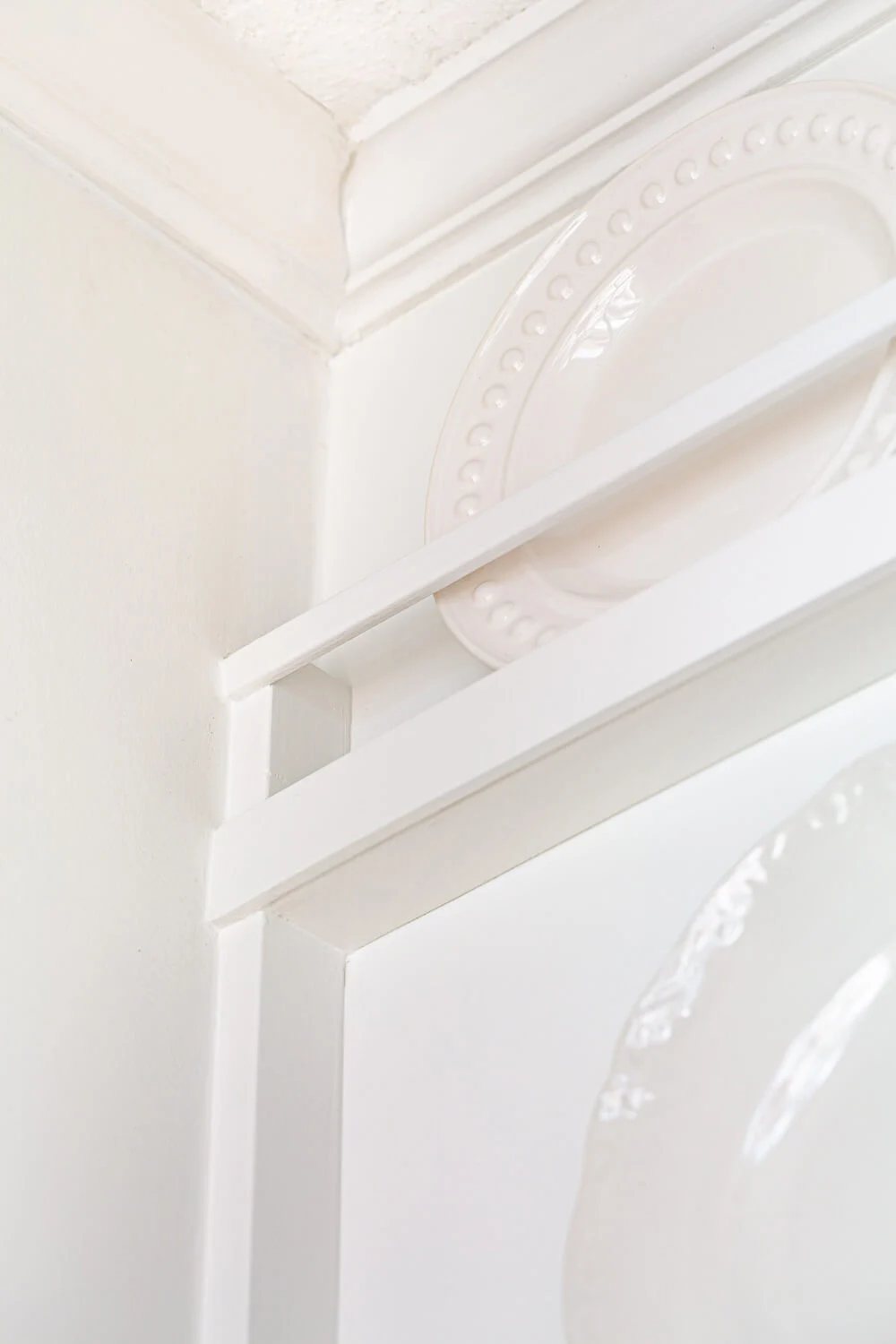 Top most section of DIY built in plate rack wall.