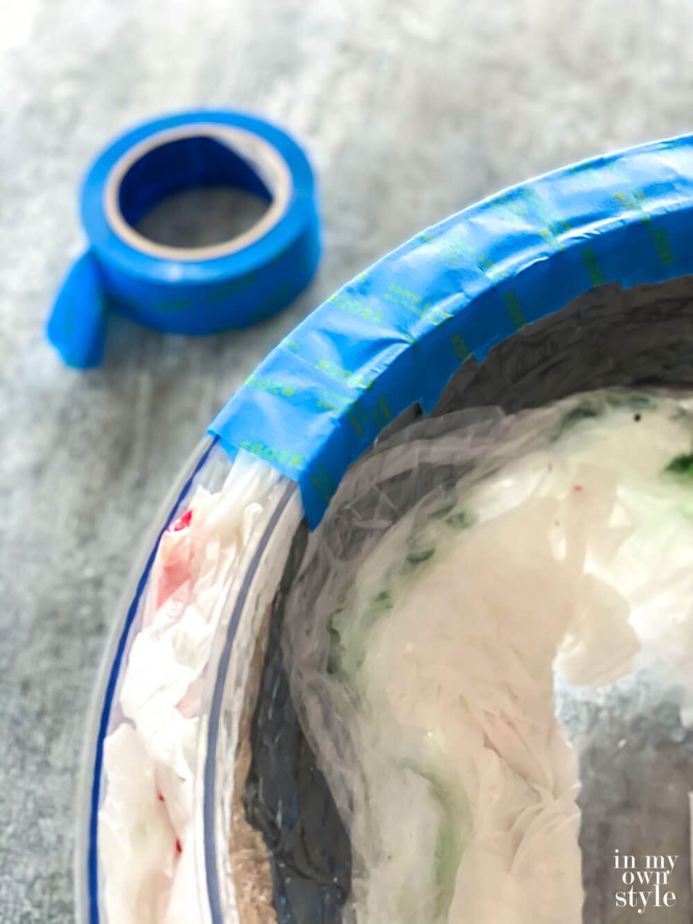 Adding painters tape around the top edge to connect both bowls that makes it appear that outer bowl is one thick bowl.