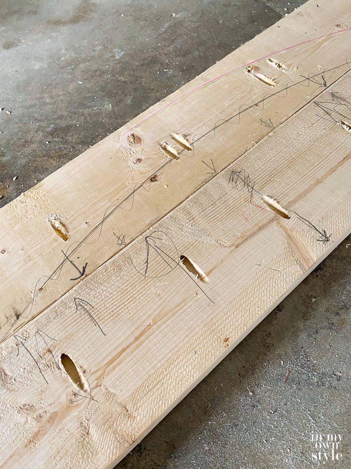 Close up of attaching boards to create a wood top for a dining table.