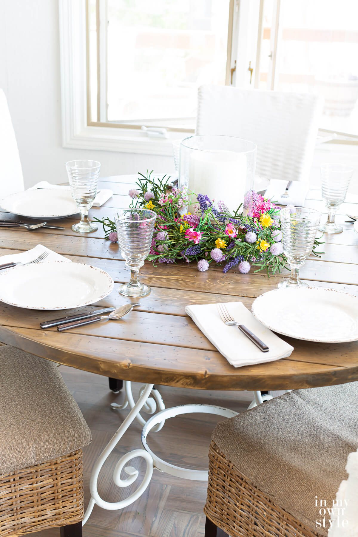 Completed DIY round wood table top set for dinner.