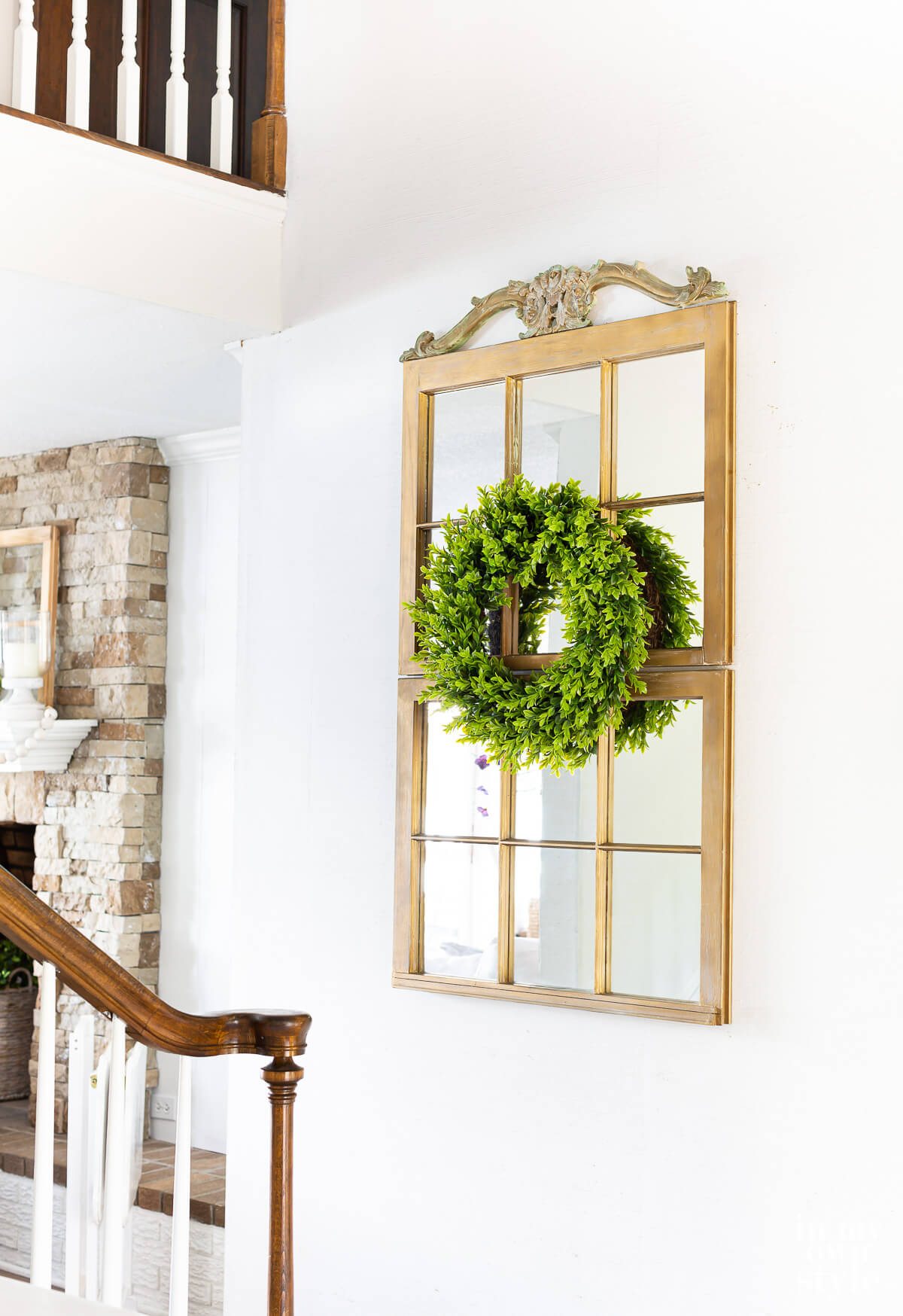 Make a decorative mirror using two old wood window frame sashes.