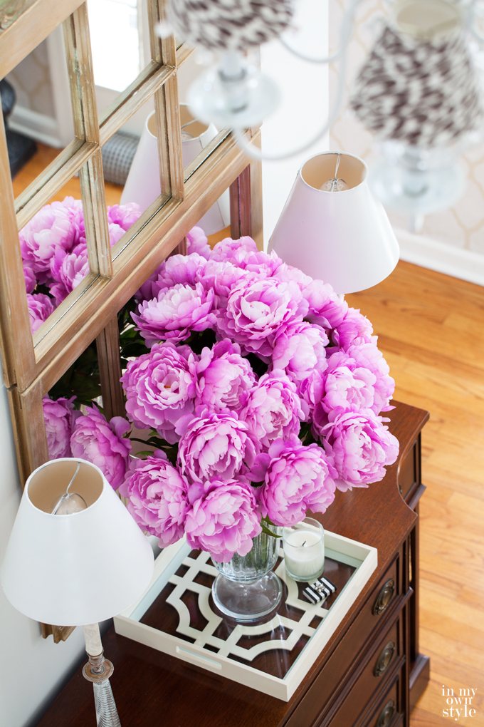 Decorating idea using old window frames in a foyer. Use one or more to make a large decorative mirror.