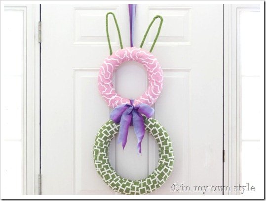 Pink and green fabric bunny wreath for a door.