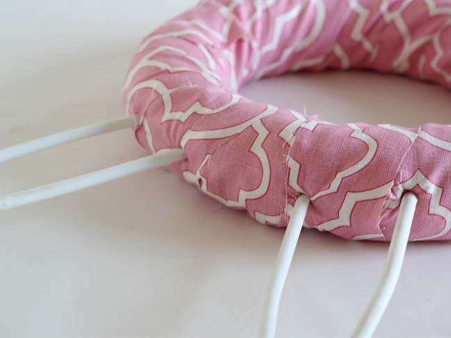 How to make ears on a bunny wreath using plastic hangers.