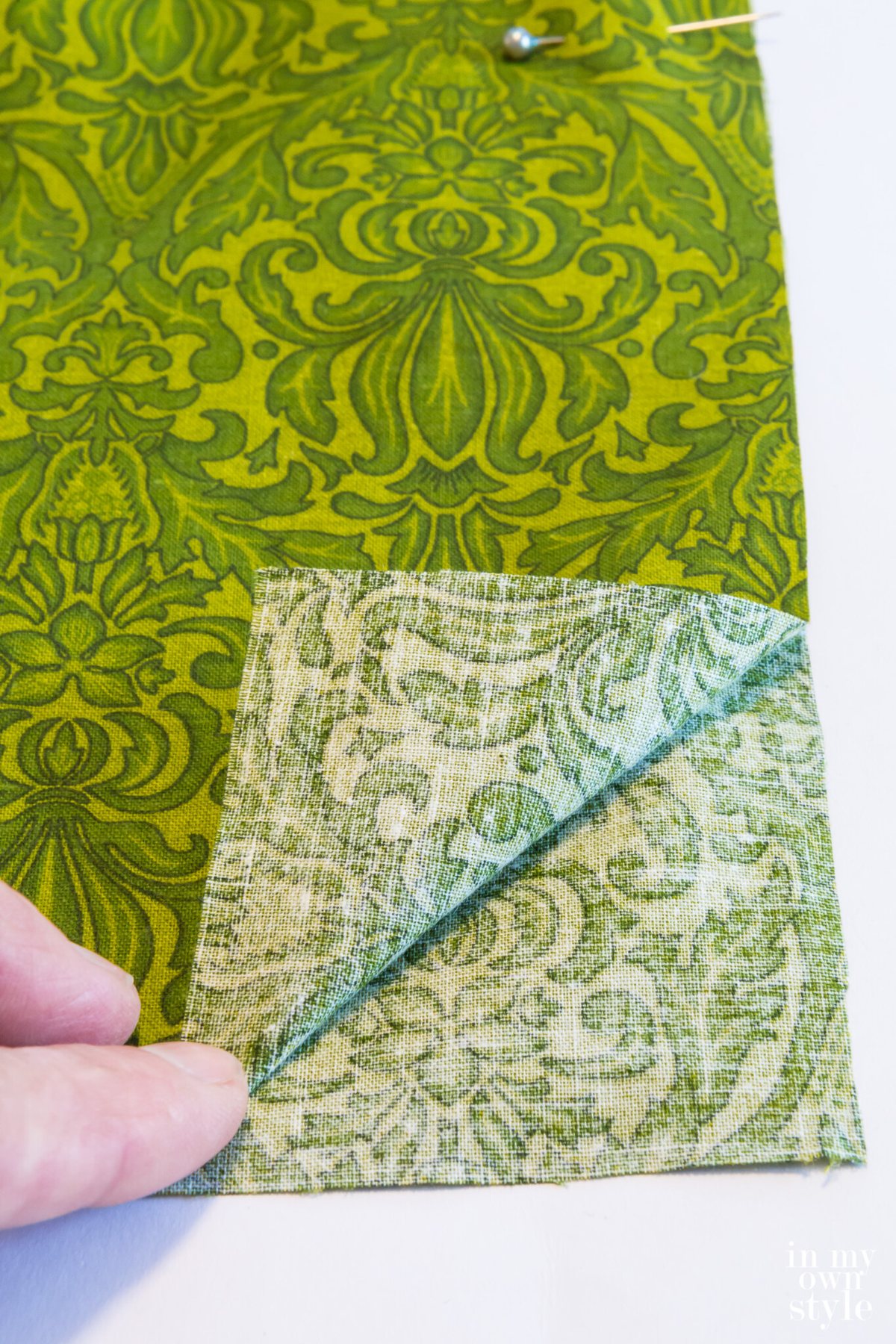 Lay pillow cover fabric wrong sides together.