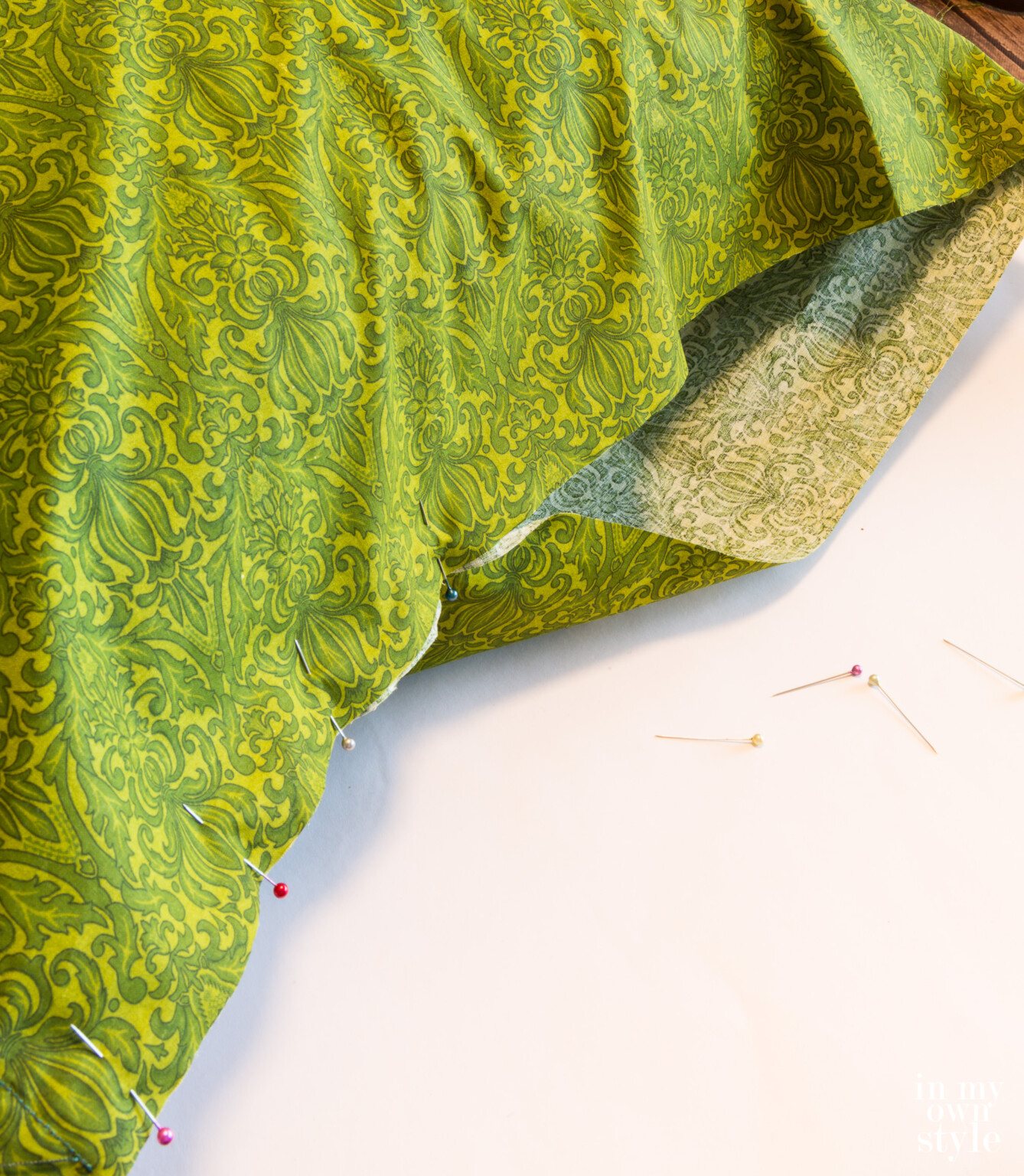 Pin and close last side of pillow cover.