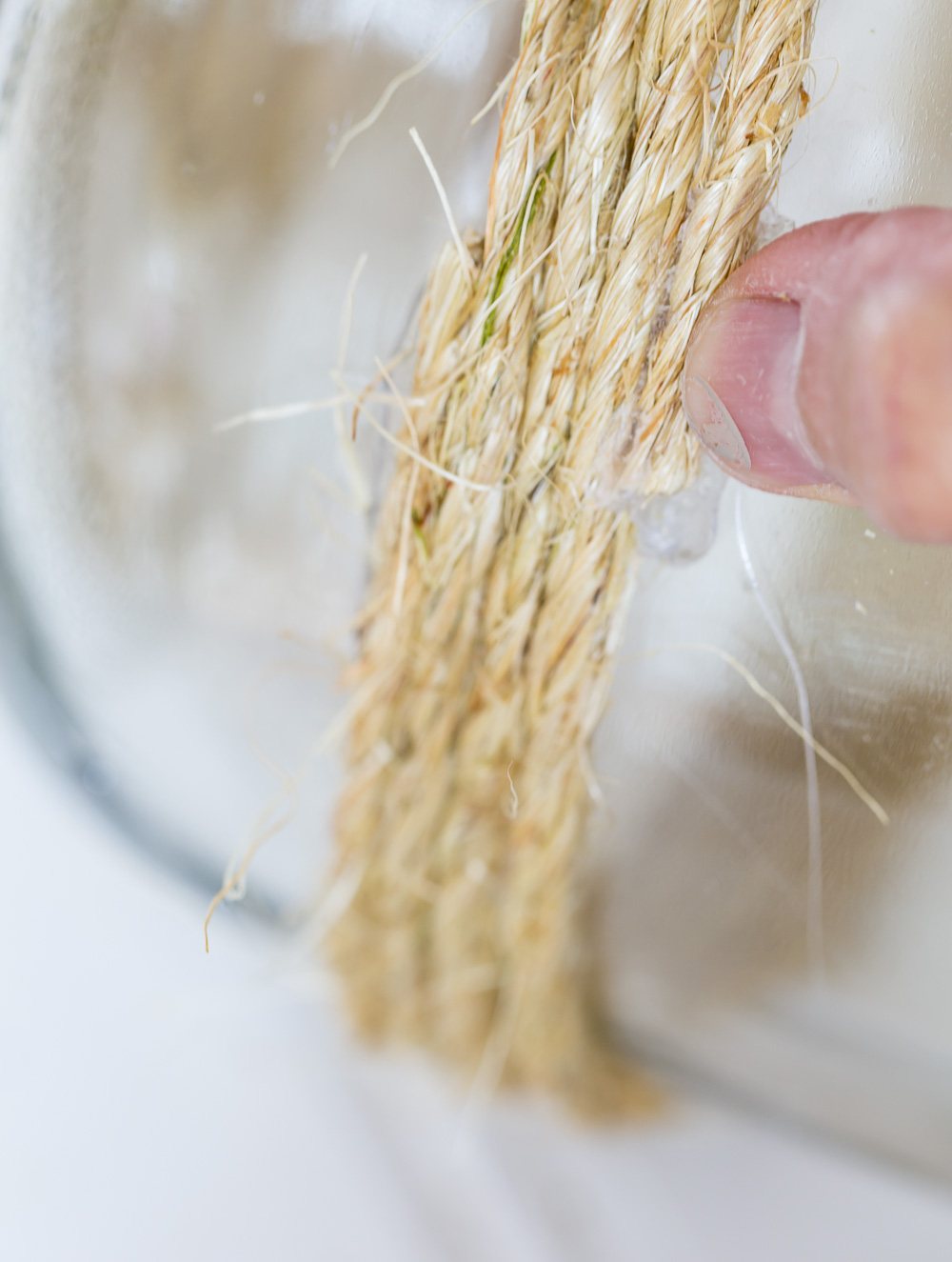 Wrapped twine around a large glass jar