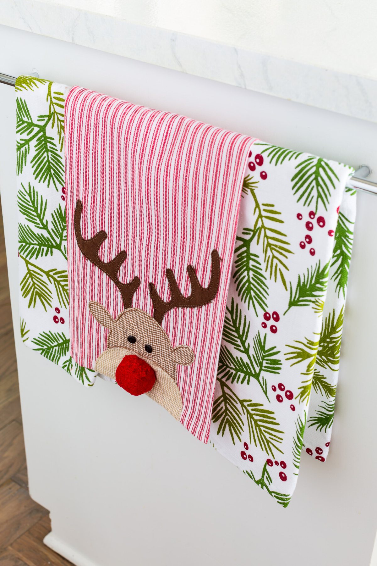 Rudolph dish towel hanging on towel bar in kitchen