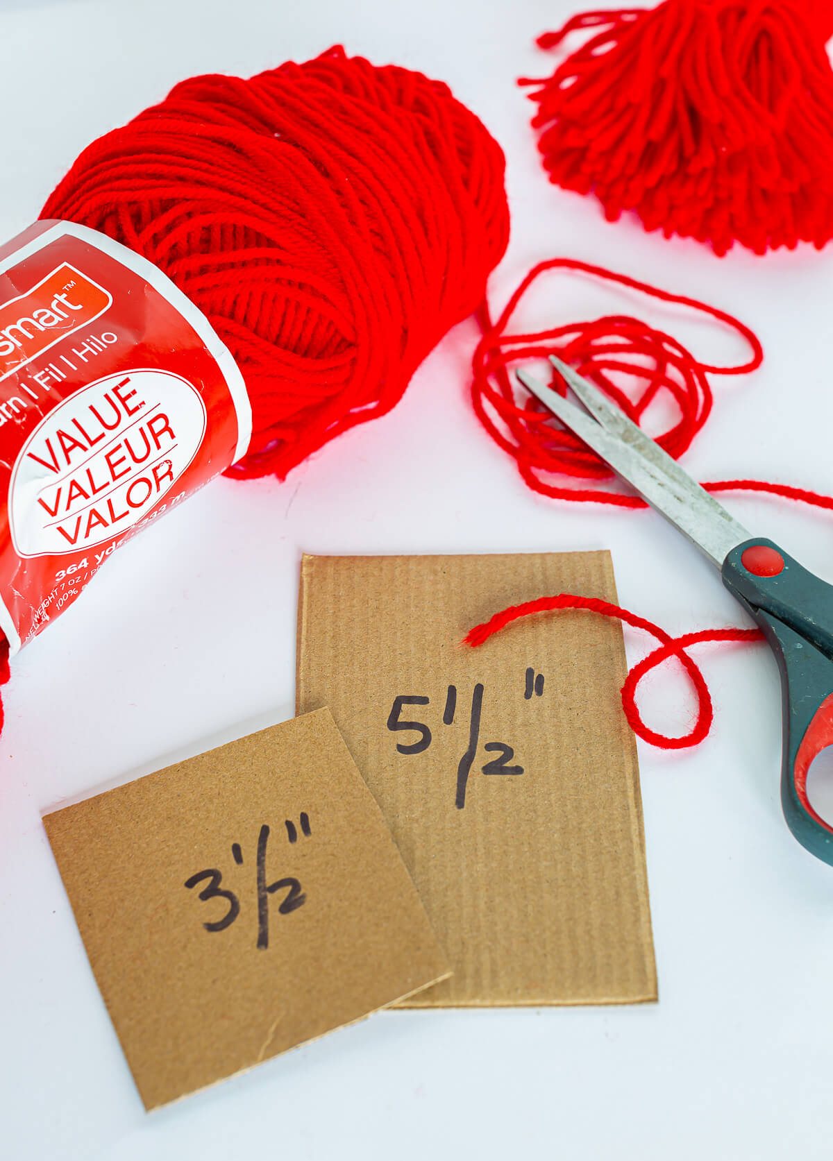 supplies needed to make a yarn tassel with a twisted cord to hang it on a key.