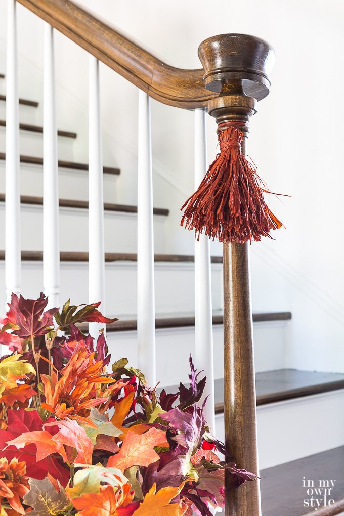 How to make raffia tassels for fall decorating. Fall staircase decorating idea.