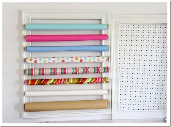 Gift-wrap organizer on wall.