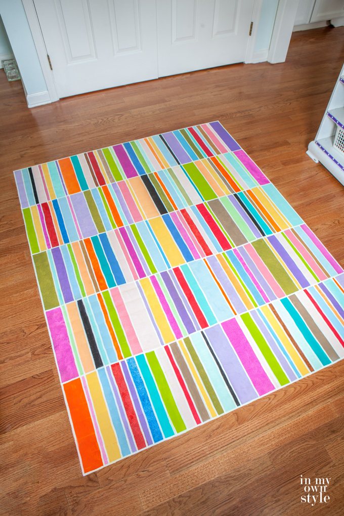 Paint a rug on a floor using a FLOR or Dash and Albert rug as inspiration