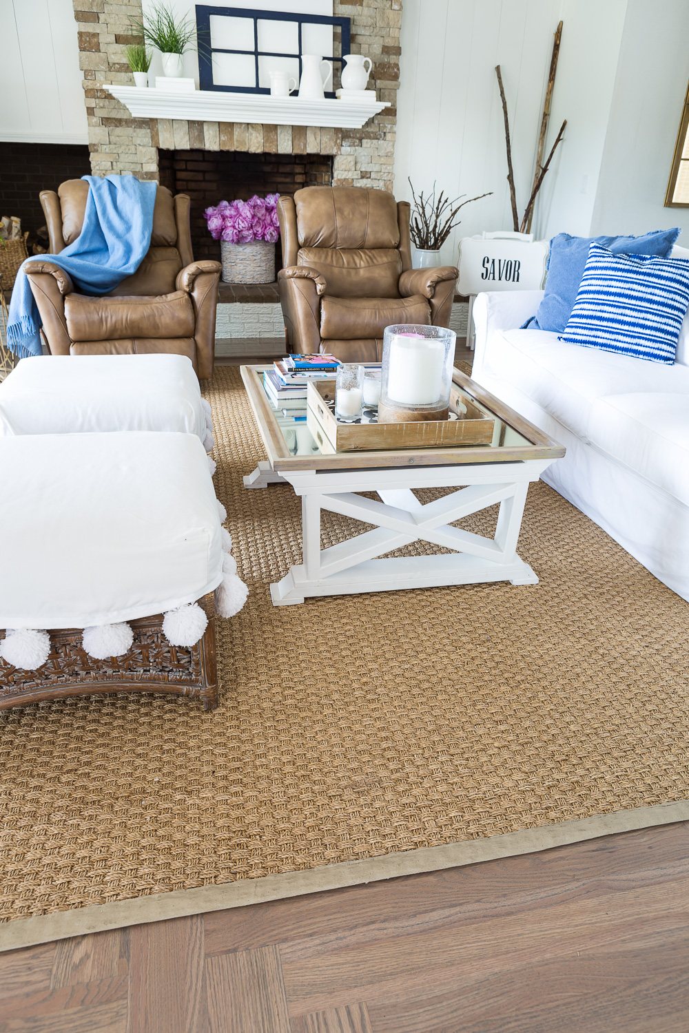 Small living room with seagrass rug with newly painted border trim.