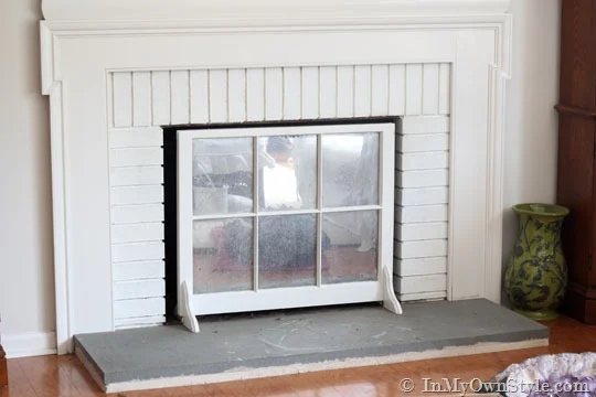 grey concrete fireplace hearth before painting