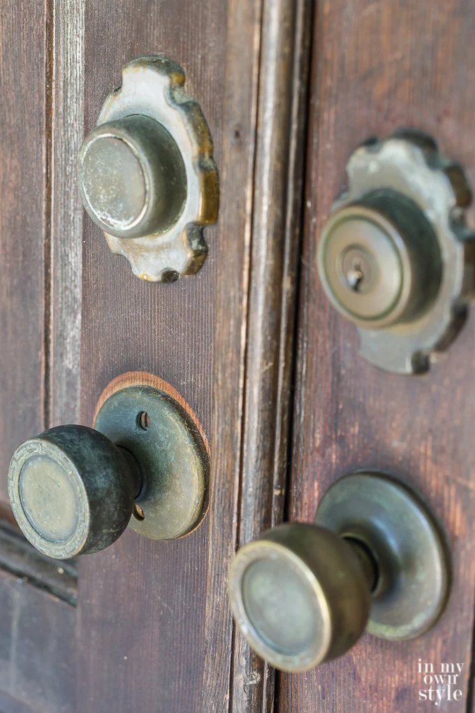 old door knobs and worn wood front door