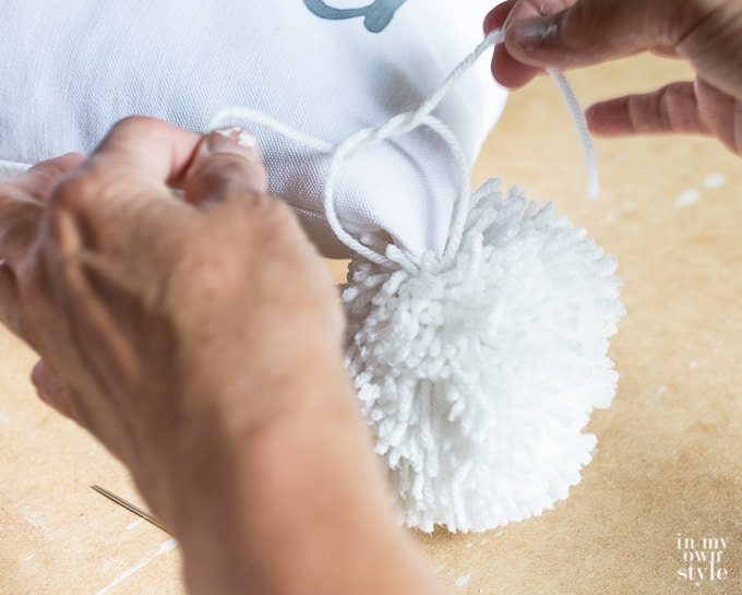 How to attach a pom-pom to a pillow