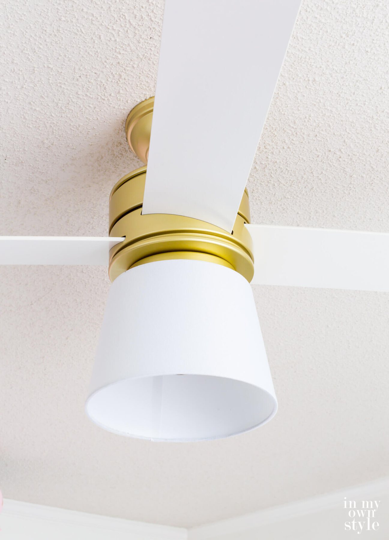 Close up of Hunter Hepburn ceiling fan with DIY replacement for a broken glass globe.
