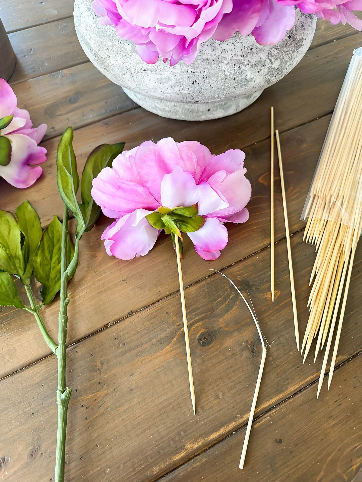 how to remove a faux flower head from a stem and then style it a different way.
