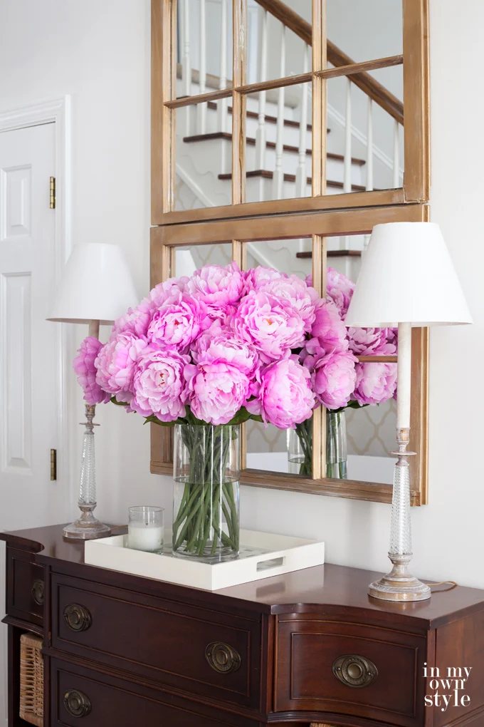 Decorating ideas using fake flowers on a tray