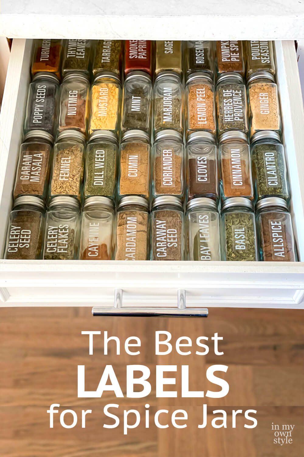 glass spice jars with labels in a drawer