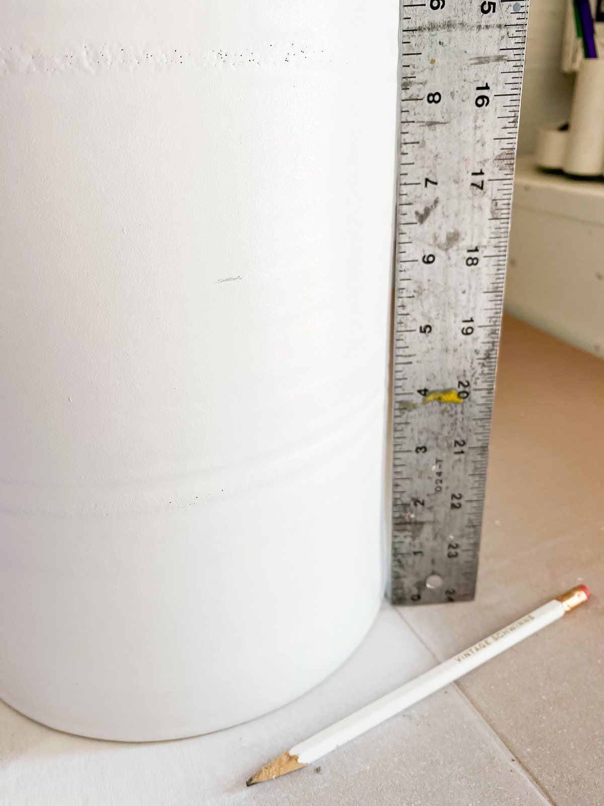 Pencil marks on lamp base to prepare for paint.