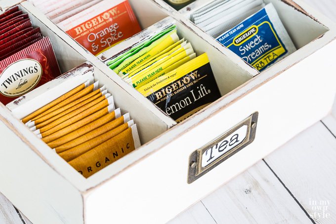 A box used to organize and store tea bags after getting a make over with leftover chalk paint