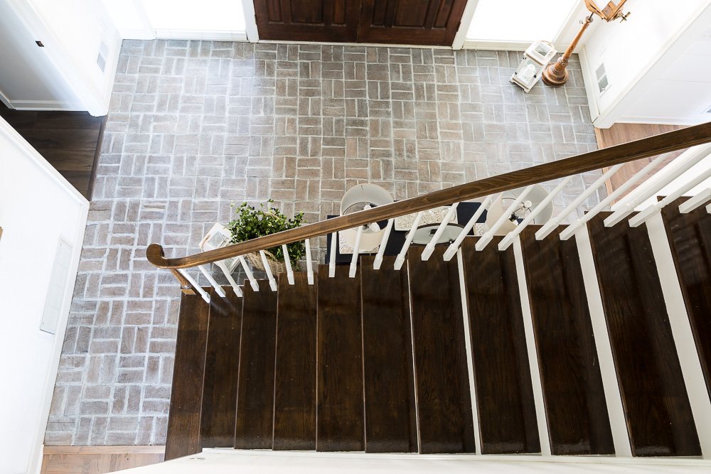 After photo showing how brick floor looks now that it has been whitewashed.
