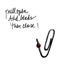 Make Paper clips pretty with small beads