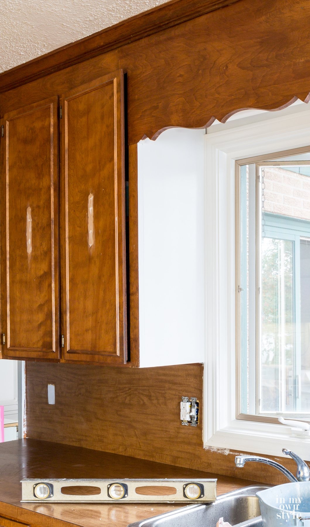 Kitchen backsplash before adding white subway tiles