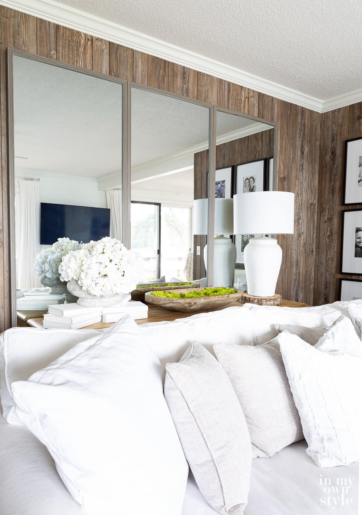 Floor mirrors hung on a living room wall.