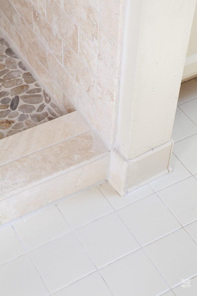 Close up of stone tile used. Beige and browns withe off-white grout.