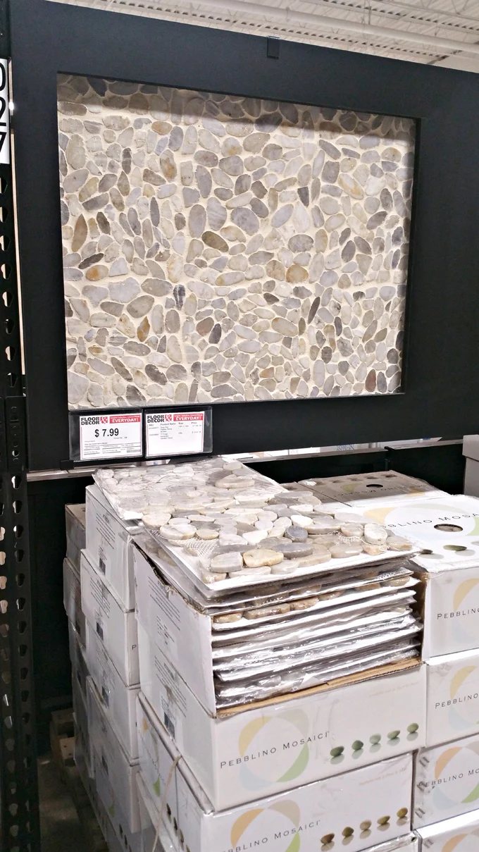 Round stone tile on display at Floor and Decor