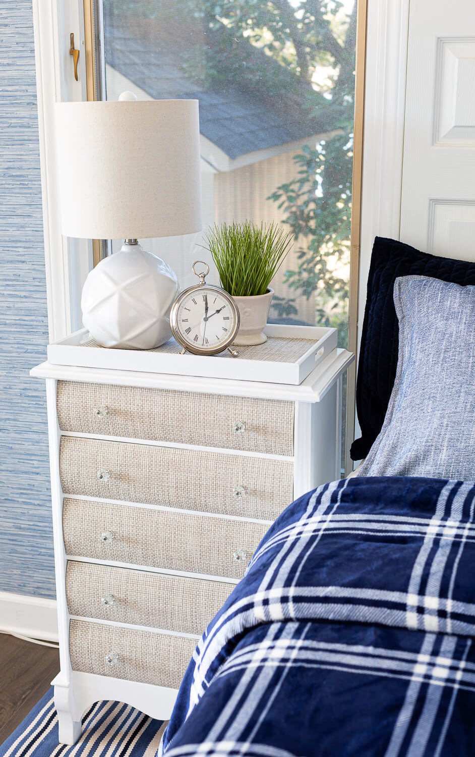 Winter blue and white bedding and woven fronted nightstand