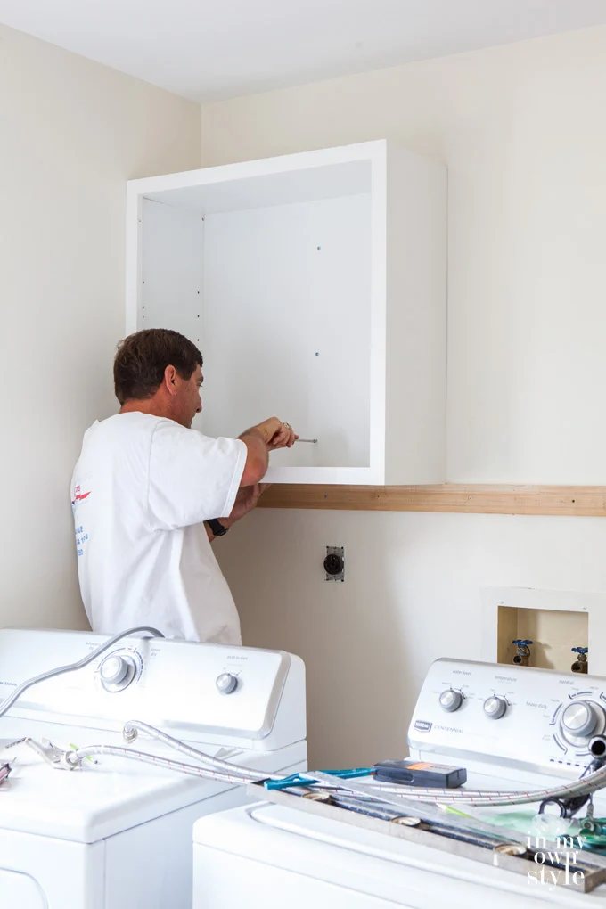 How to install wall cabinets above a washer and dryer