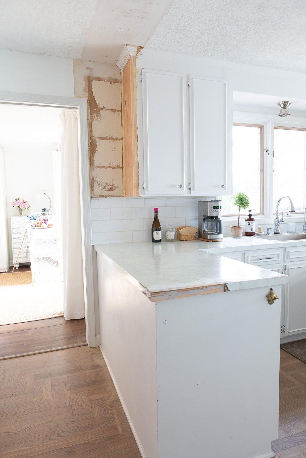 After photo showing how kitchen counter and are where upper cabinets were removed looks