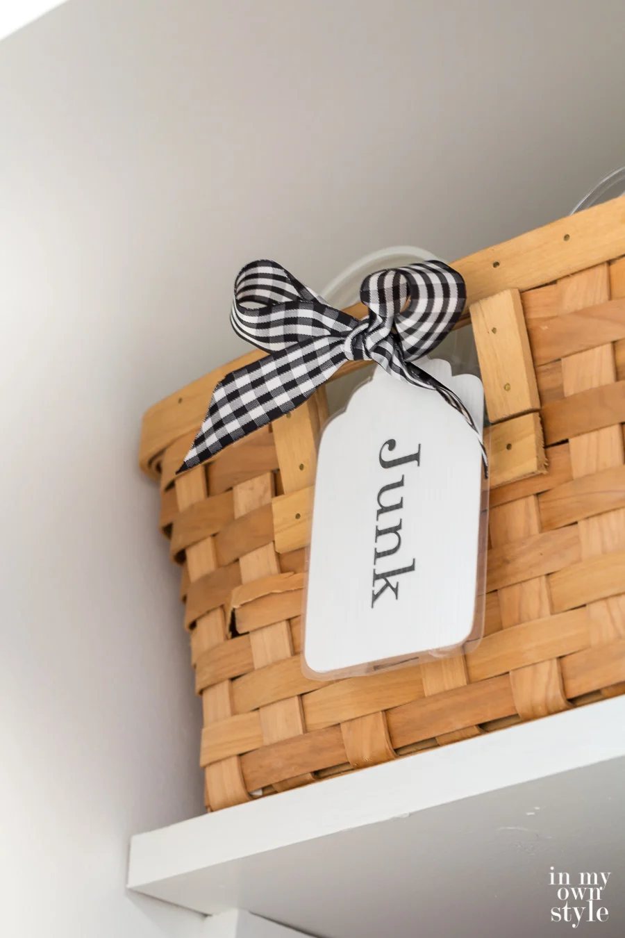Junk label on basket in newly painted closet