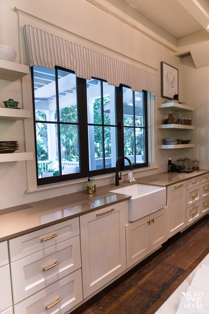Windows that wow. This is a bi-fold kitchen window that slides open like a drive up window does.