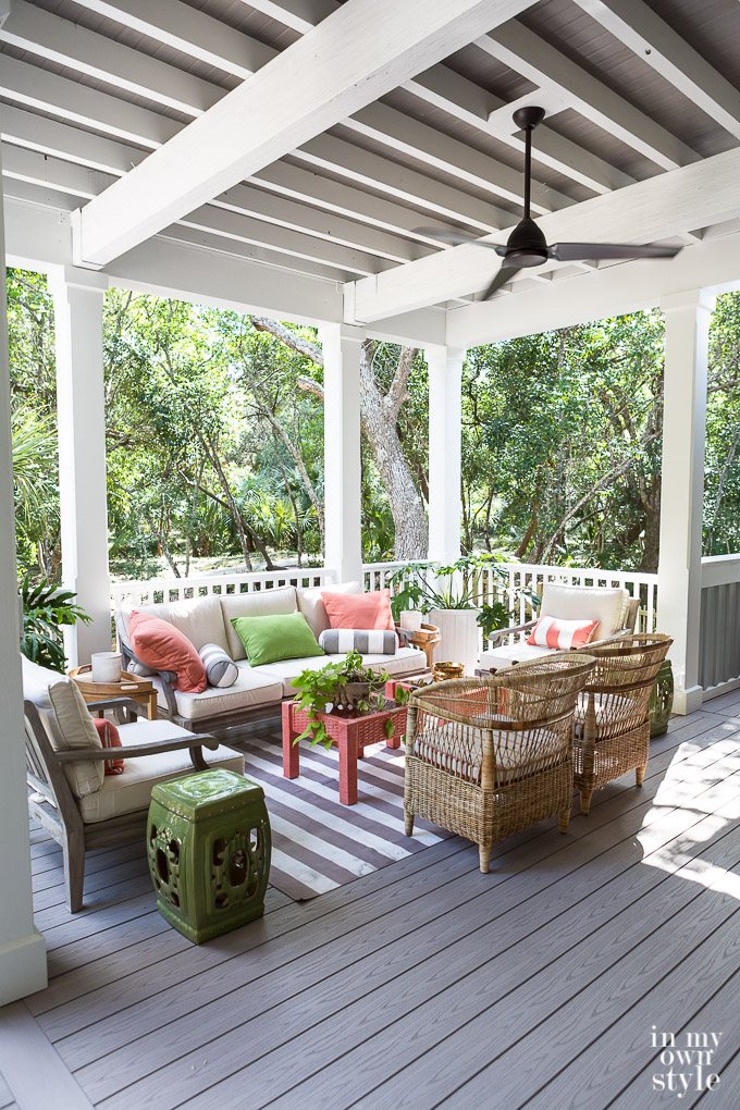Outdoor porch using a coral and green color scheme.
