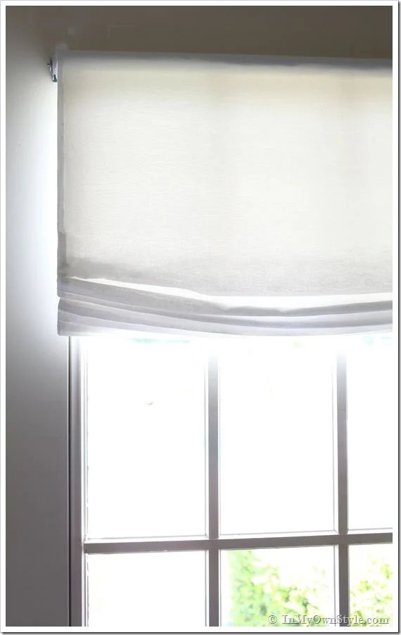No-sew-Relaxed-Roman-shade-window-treatment hanging from a window