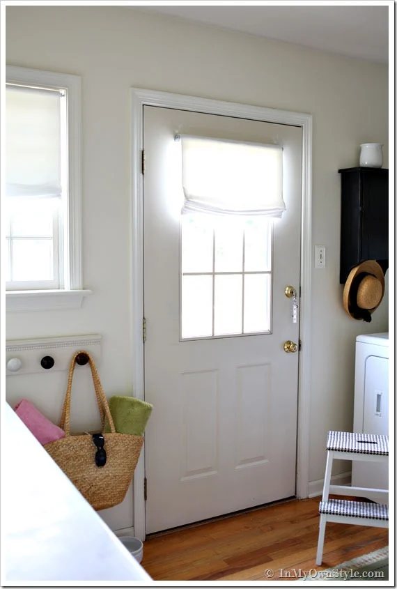 Mudroom showing a no sew Roman Shade on the exterior door