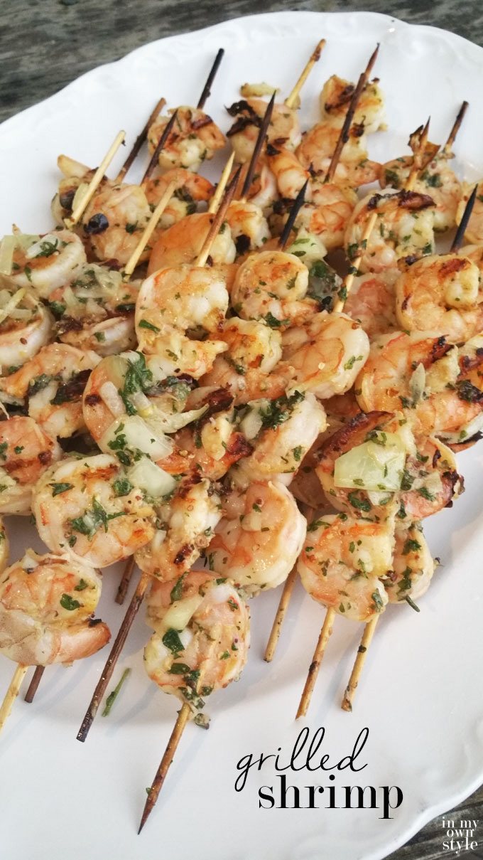 Outdoor party food that is easy to prepare and cook for a crowd. Herb grilled shrimp skewers require no utensils making them easy for guests to eat. | Oducu