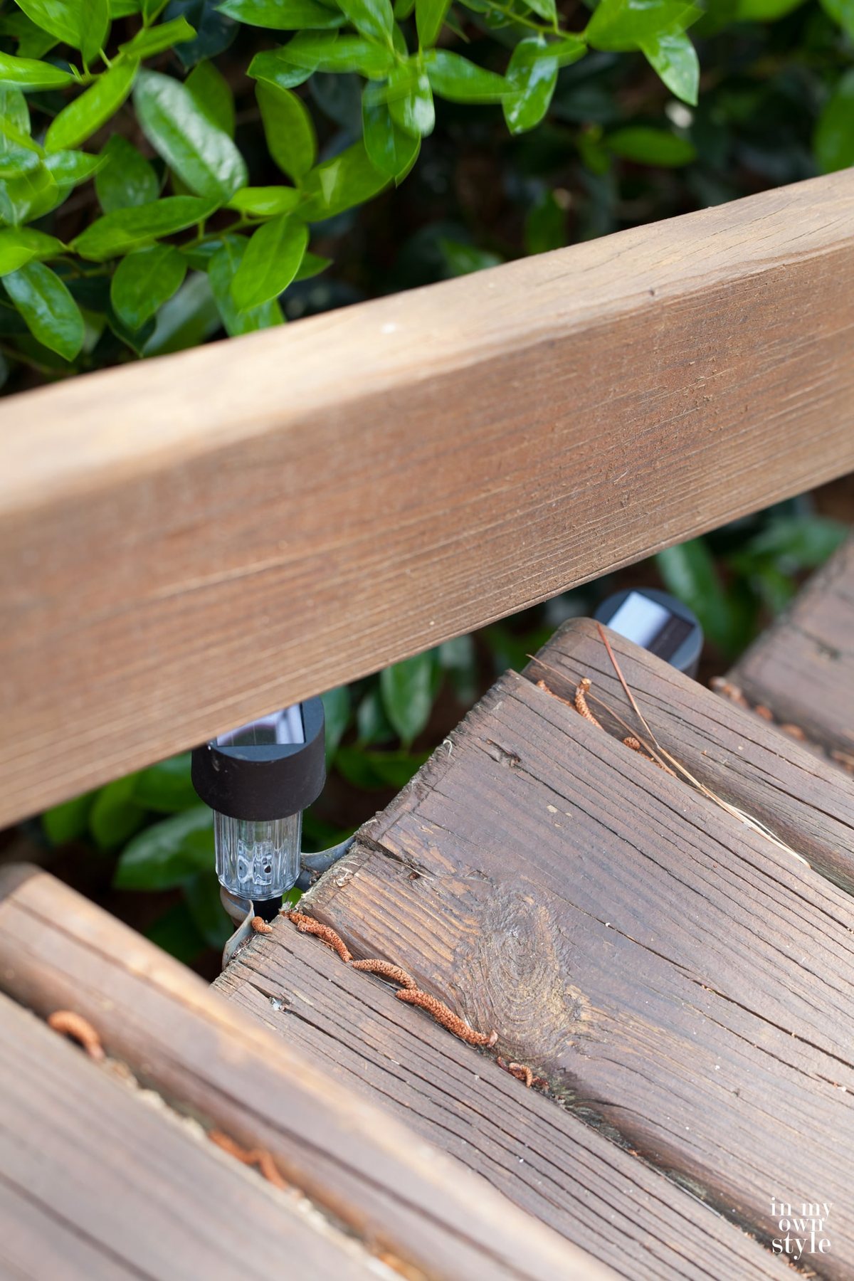 Smaller black solar lights along outer edge of steps.