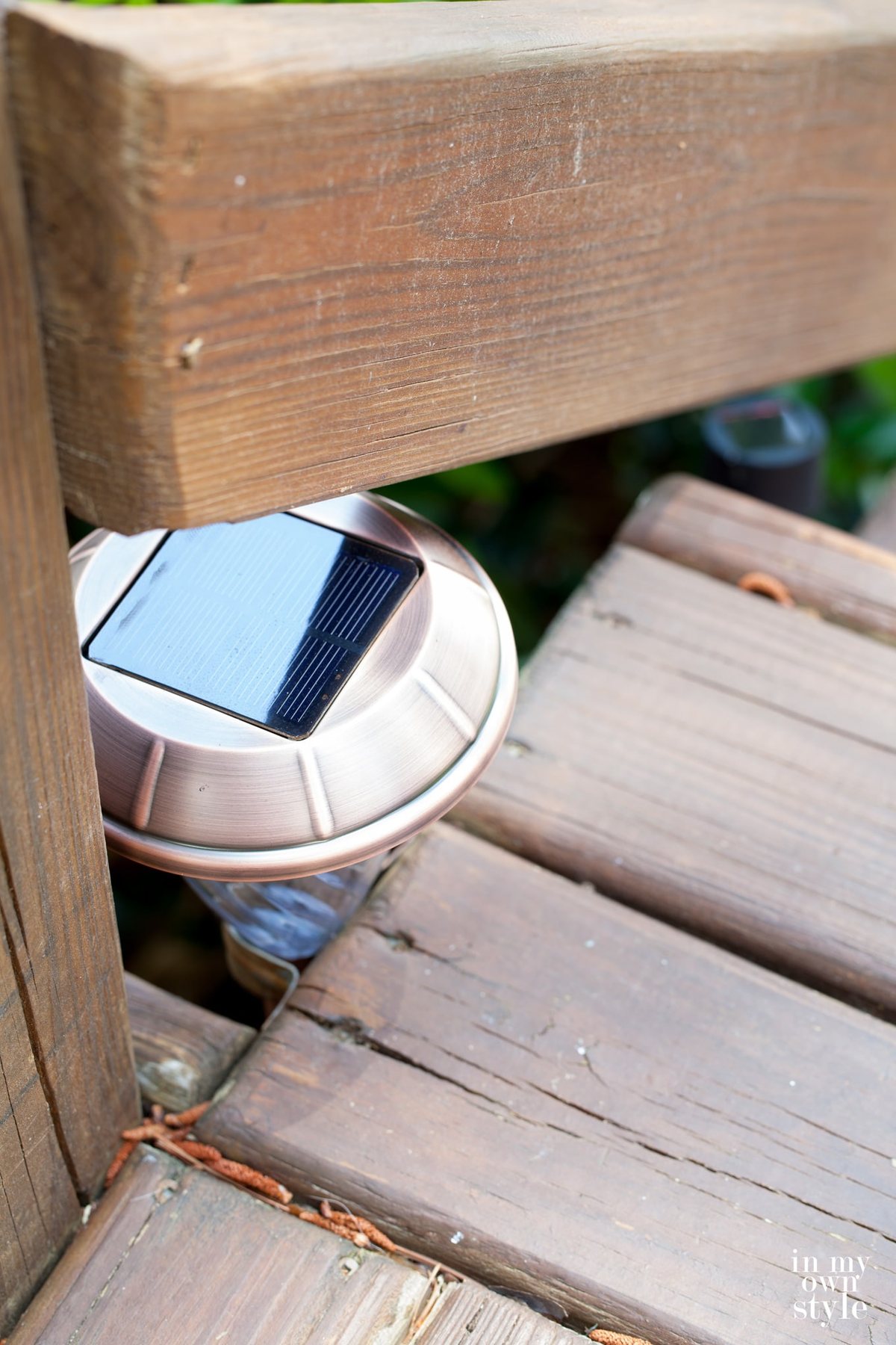 Solar light in bracket provides just the right amount of outdoor deck lighting.