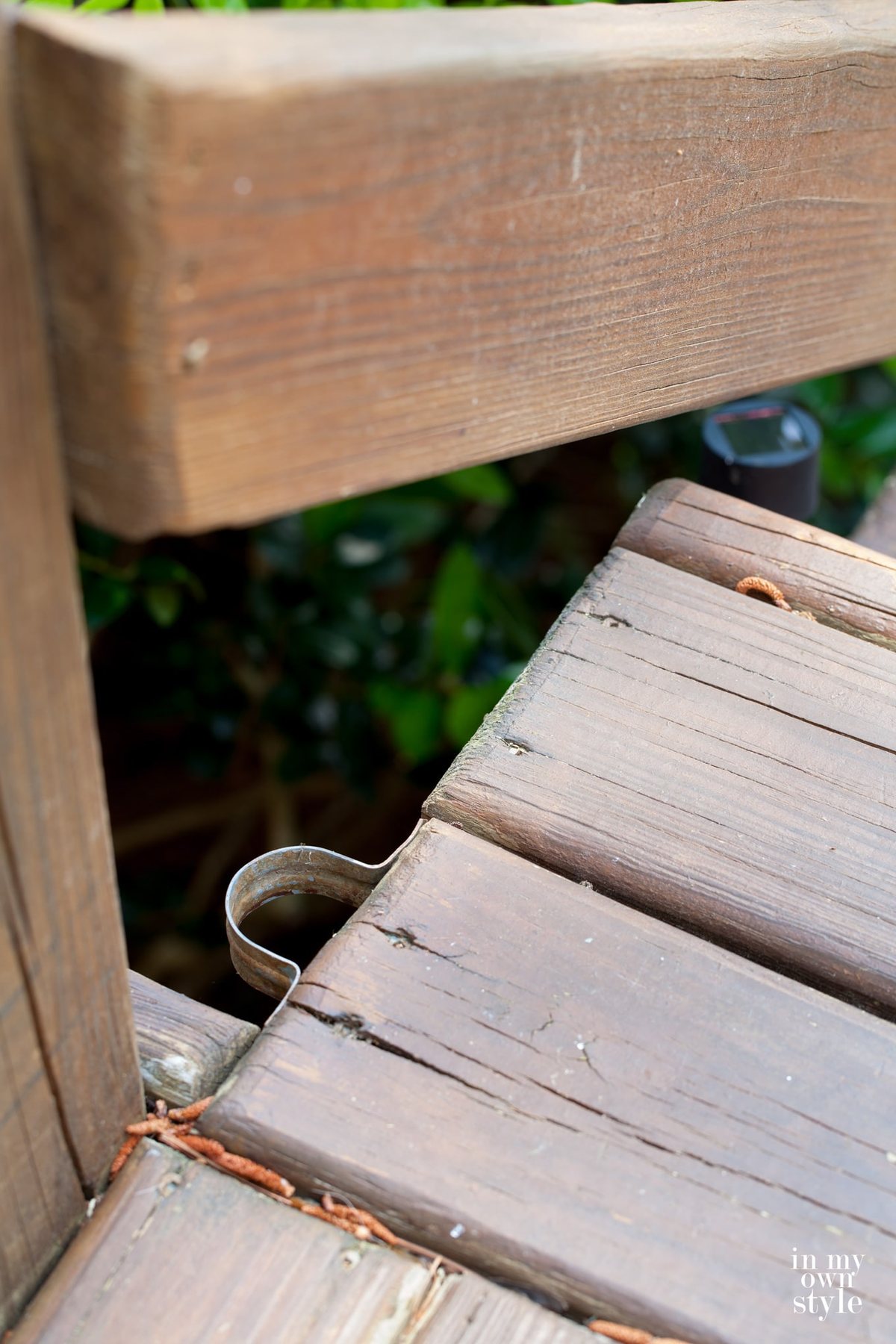 Pole bracket attached to side of deck steps that will provide a place for outdoor deck lighting.