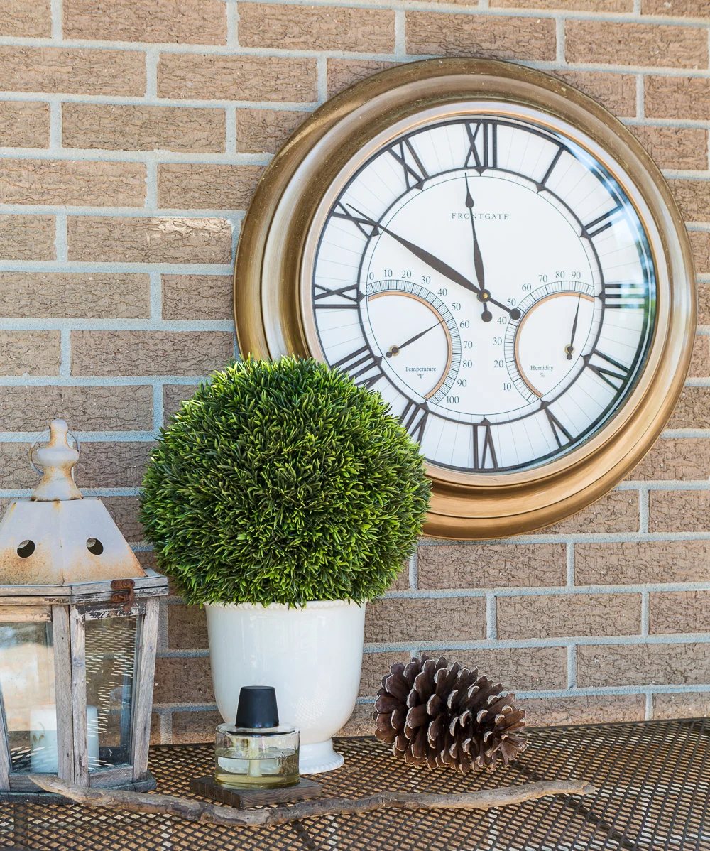 Outdoor clock on brick wall