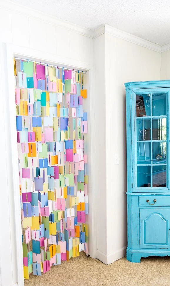 How to make a colorful curtain for a doorway using paint chip swatches.