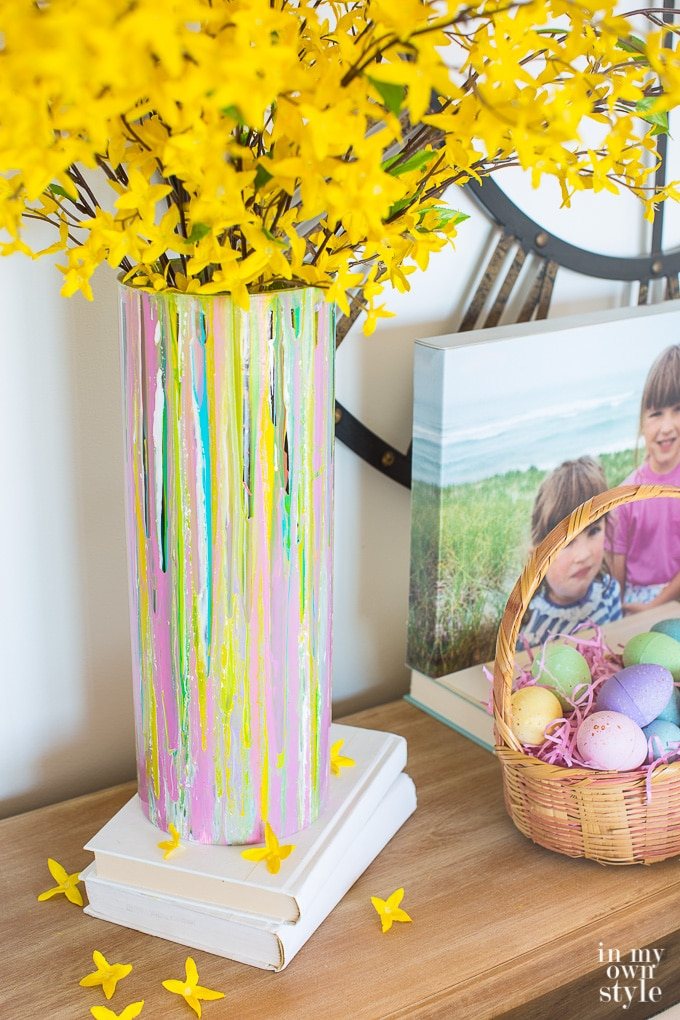 Spring decor. Painted glass vase on a console table