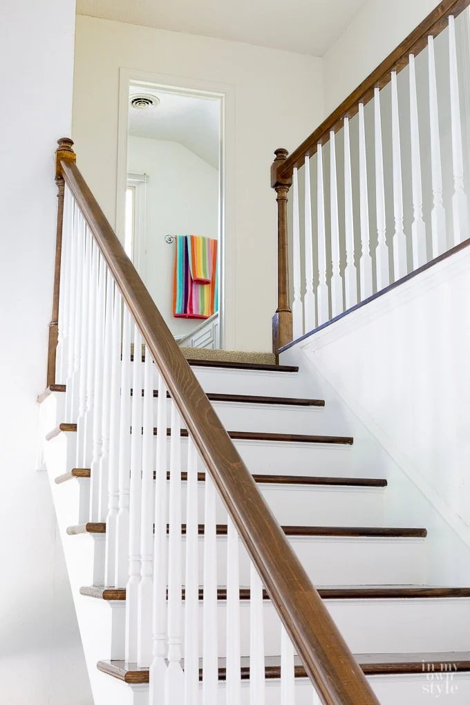 Staircase makeover showing how to remove carpet and paint risers and stain steps for a clean modern look