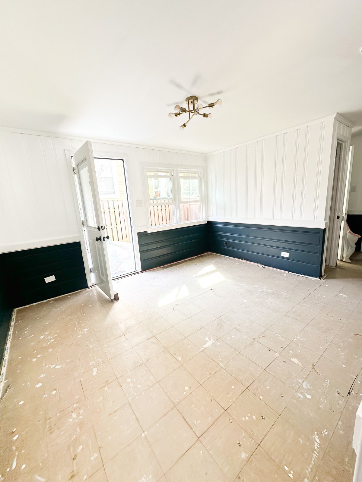 sunroom after removing yucky carpet and scrubbing floor clean.